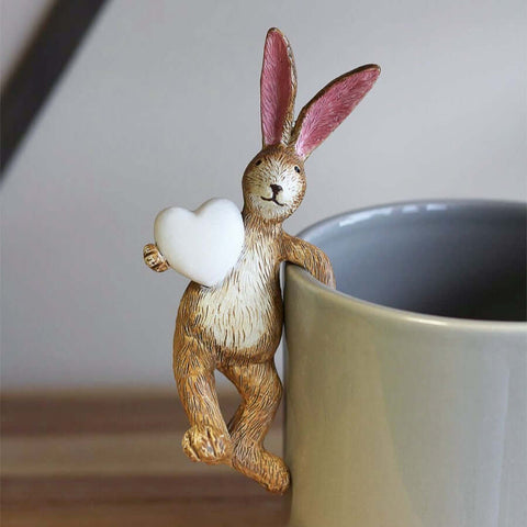 Rustic style pot hanging rabbit holding a white heart