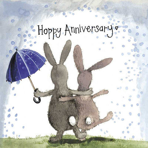 Alex Clark anniversary card with two rabbits dancing arm in arm under an umbrella in the rain