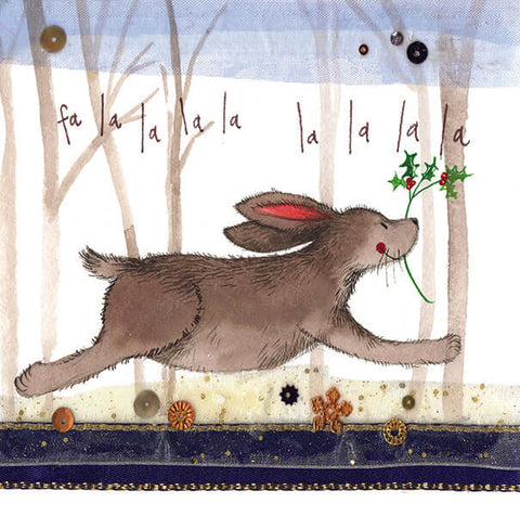 Alex Clark Christmas card with a rabbit running through the woods