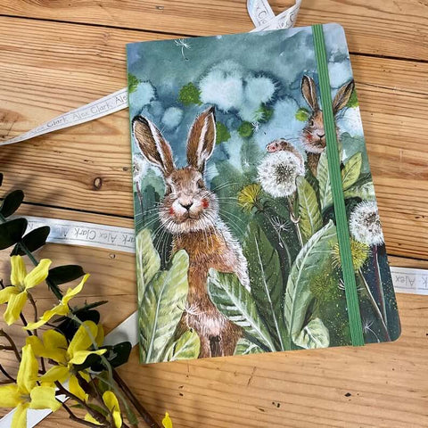 Alex Clark notebook featuring two rabbits  among the dandelions
