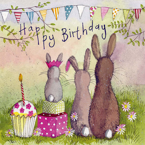 Alex Clark birthday card with 3 rabbits on the grass surrounded by gifts and a cake