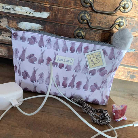 Alex Clark zipped wash bag with repeat rabbit pattern in pale purple